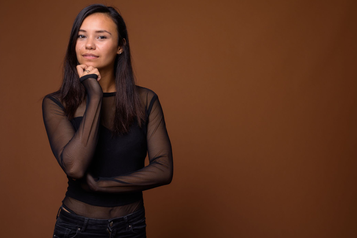 woman thinking brown background